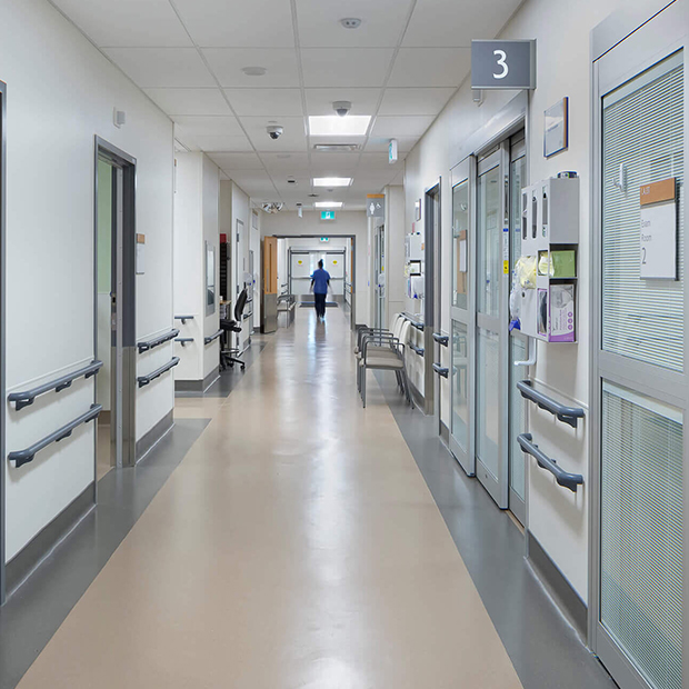 Hospital corridor with patient rooms